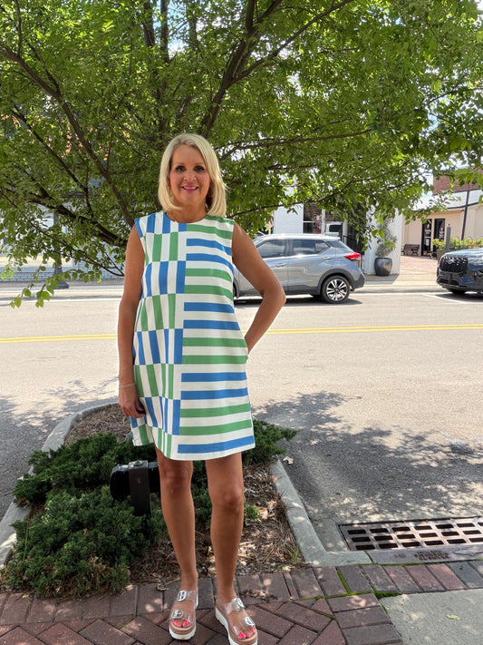 Stripe print sleeveless mini dress featuring color block panel detail