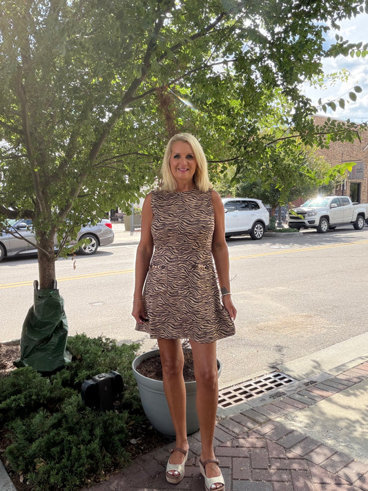 Animal print sleeveless mini dress with a round neckline
