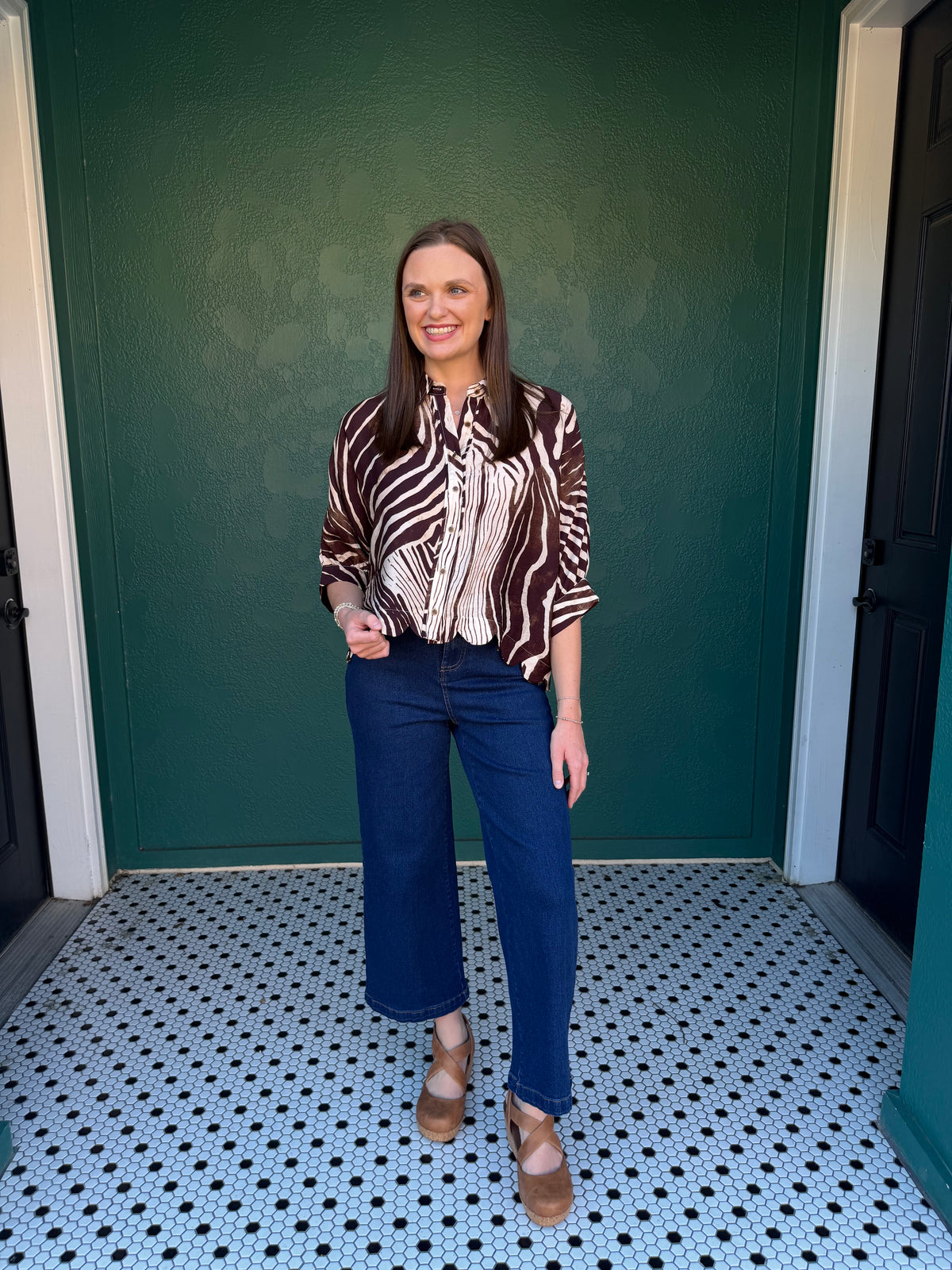 Zebra print poncho sleeve top with a shirt collar and button closure at front